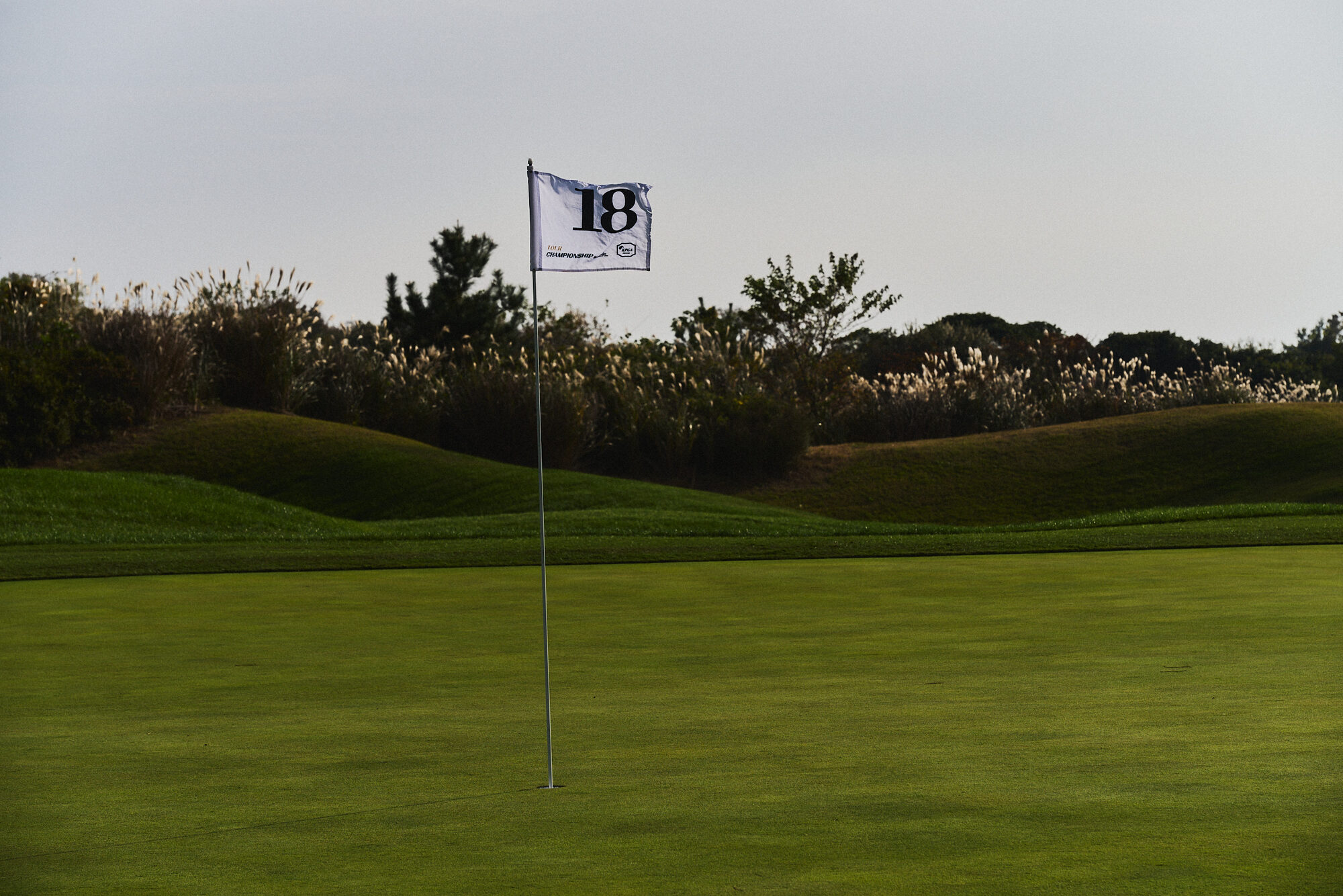 A moving figure and a player on the course during the KPGA event in Jeju. Image 2.