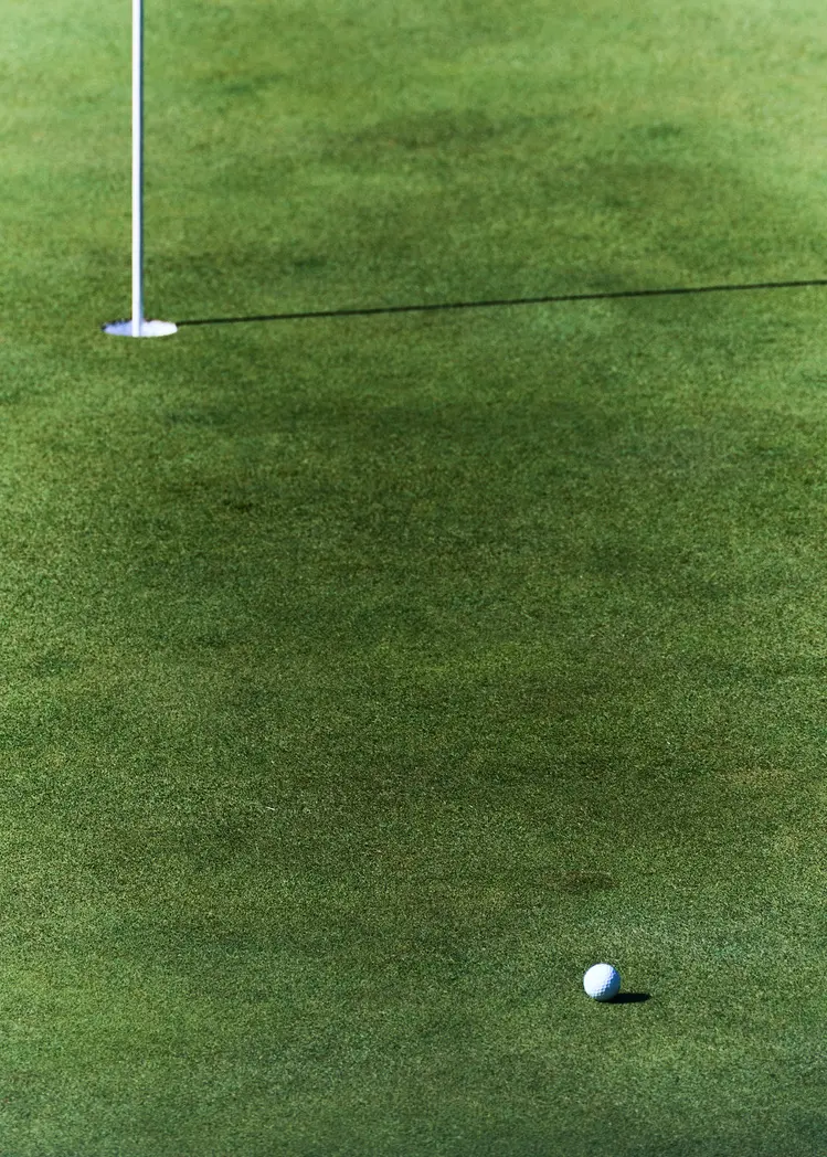 A moving figure and a player on the course during the KPGA event in Jeju. Image 6.