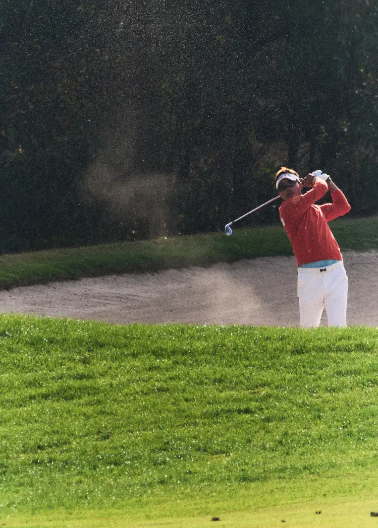 A moving figure and a player on the course during the KPGA event in Jeju. Image 8.